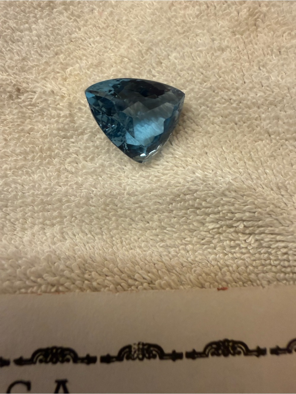 Blue Trillion-Cut blue topaz. 22 carat